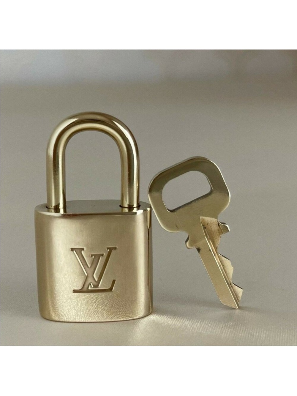 Louis Vuitton Gold Padlock and Key Set